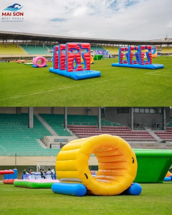 đồ chơi bơm hơi team building trên sân cỏ